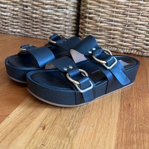 Black platform sandal.